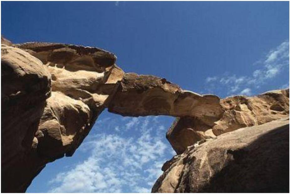 Natural stone bridge in the rocks of Wadi Rum
